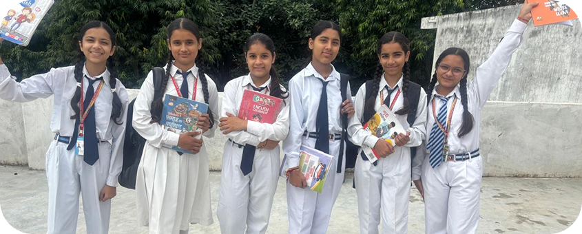 Group of students holding their books